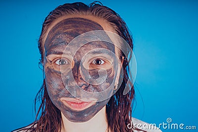 The girl put on the face mask for acne. The concept of facial Stock Photo