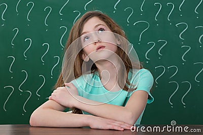 Girl With Question Mark Drawn On The Chalkboard Stock Photo