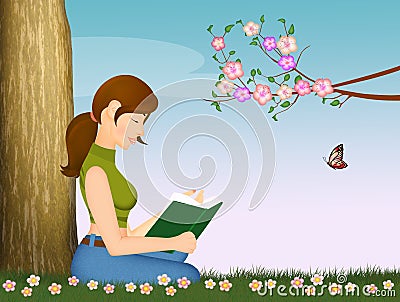 Girl reads book sitting in the meadow Stock Photo