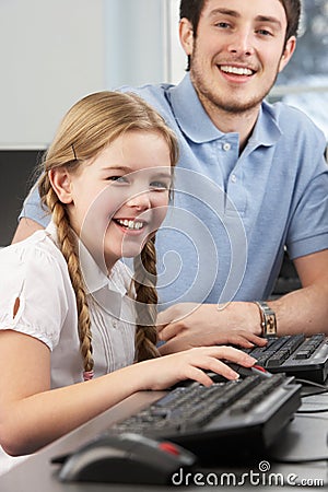 Girl receiving one to one help from teacher Stock Photo