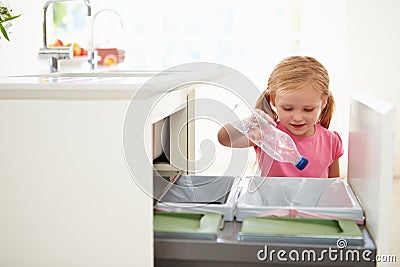 Girl Recycling Kitchen Waste In Bin Stock Photo