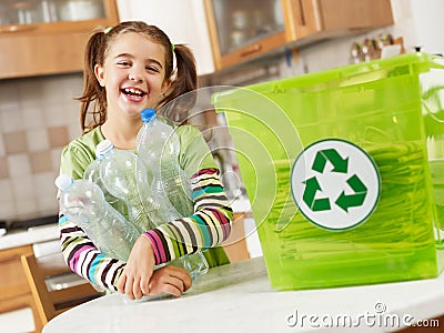 Girl recycling plastic bottles Stock Photo