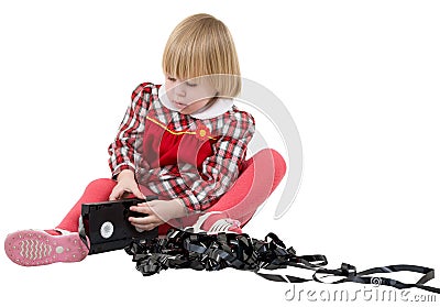 Girl in the red dress with video cassette Stock Photo