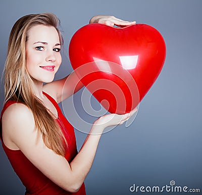 Girl with red heart Stock Photo