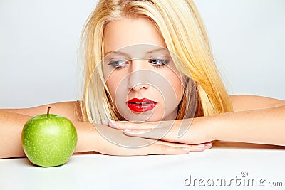 Girl with red lips and green apple Stock Photo