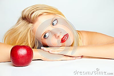 Girl with red lips and a red apple Stock Photo