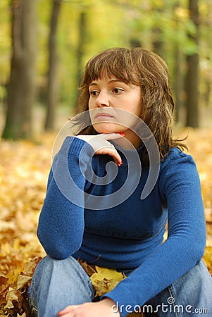 The girl reflecting in an autumn wood Stock Photo