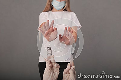 The girl refuses the proposed vaccine. covid. virus. graft Stock Photo
