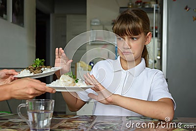 The girl refuses to eat homemade food for lunch Stock Photo