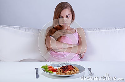 Girl refusing to eat dinner Stock Photo