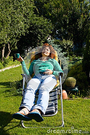 Girl relax in chaise longue on garden Stock Photo