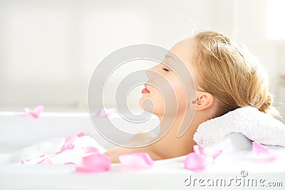 Girl relaxing in bathtub Stock Photo