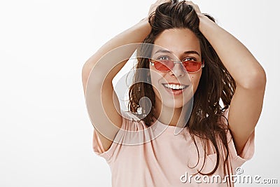 Girl relaxing and chilling on awesome party having fun looking stylish and cool wearing red trendy sunglasses playing Stock Photo