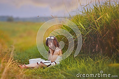 Girl relaxing in grass Stock Photo