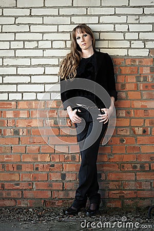 Girl rely on wall Stock Photo