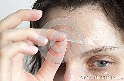 The girl removes a face mask mask, close-up mask Stock Photo