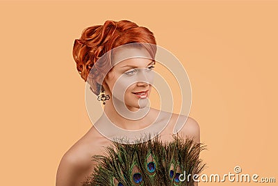 Girl retro style with peacock feathers dress Stock Photo