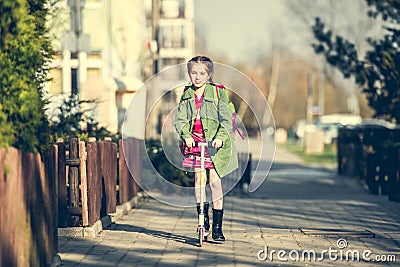 Girl returning from school Stock Photo