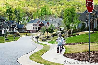 Girl Riding Bike Home Stock Photo