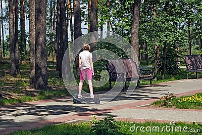 Girl riding in the Park on a self-balancing scooter Editorial Stock Photo