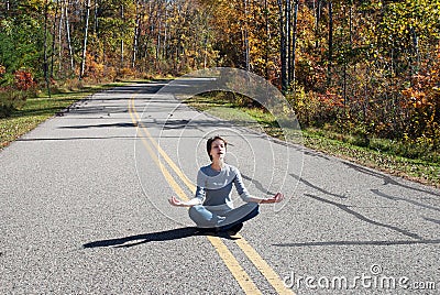 Girl, road and autumn forest, Marinette county; Wisconsin; Stock Photo