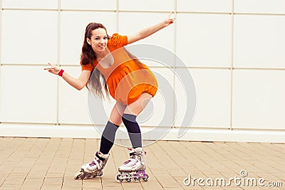 Girl rollerblading in street city Stock Photo
