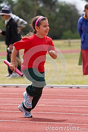 Girl running in sports race Stock Photo