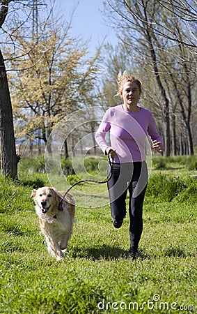 Girl running with your dog Stock Photo