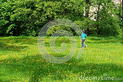 Girl runs along the trail, summer sunny day. Editorial Stock Photo