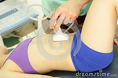 Girl's abdominal cavity diagnosis with an ultrasound Stock Photo