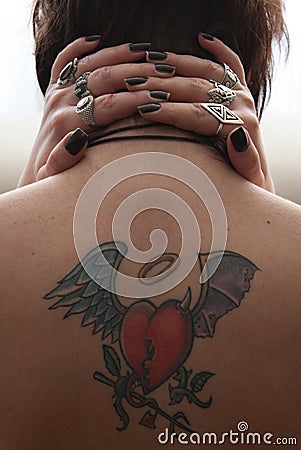 Girl's back tattoo Editorial Stock Photo