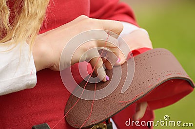 The girl's hemming shoes. Stock Photo