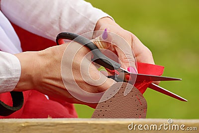 The girl`s hemming shoes. Stock Photo