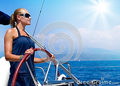 Girl Sailing a Sailboat Stock Photo