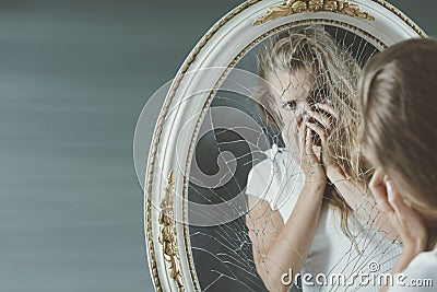 Girl scared of herself Stock Photo