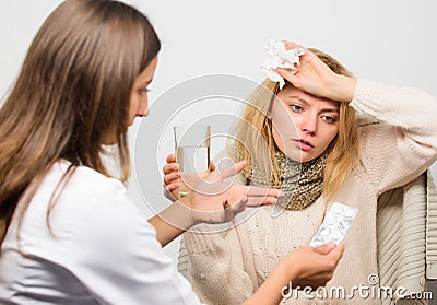 Girl in scarf hold tissue while doctor offer treatment. Cold and flu remedies. Tips how to get rid of cold. Recognize Stock Photo