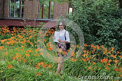 Girl schoolgirl with a folder in his hands Stock Photo