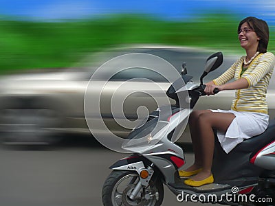 Girl on scooter Stock Photo