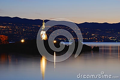 Girl with Seagull with Rijeka in the Background Stock Photo