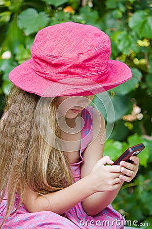 GIRL SENDING SMS Stock Photo