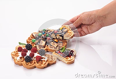 Girl served waffles with blueberry jam, Breakfast with coffee. White background, top view Stock Photo