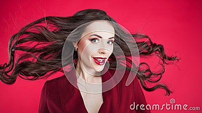 Girl in shock on pink background. Young beautiful woman with hair up. Stock Photo