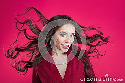 Girl in shock on pink background. Young beautiful woman with hair up. Stock Photo