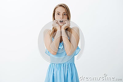 Girl shocked witnessing friend ruined b-day cake gasping standing in stupor shook and speechless dropping jaw holding Stock Photo