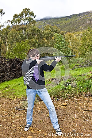 Girl shooting airgun Stock Photo