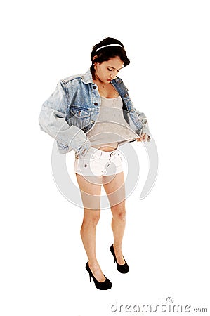 Girl in shorts and jacket. Stock Photo