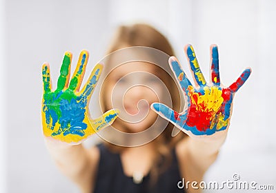 Girl showing painted hands Stock Photo