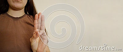 Girl showing three fingers gesture her hand. Prisoner& x27;s Day. Day of Non-Violence Stock Photo