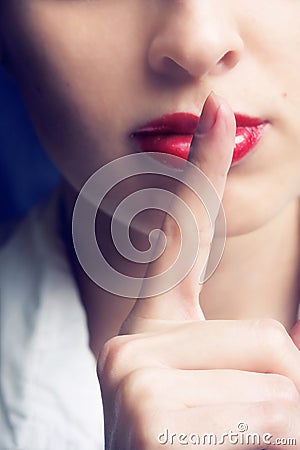 The girl shows a silence sign Stock Photo