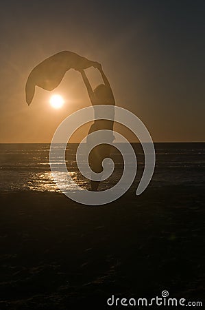 Girl silhouette against sunset Stock Photo